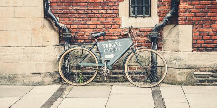 A vintage bicycle advertising a cafe 